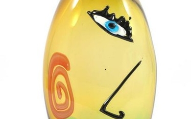 Colored glass vase with face