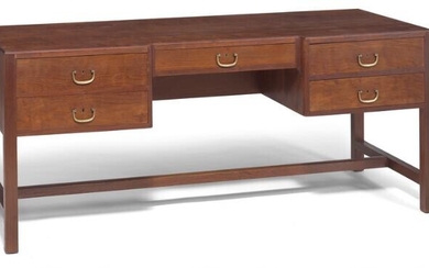 NOT SOLD. Danish cabinetmaker: Freestanding teak desk. Front with five drawers with brass handles. Reverse side with bookshelf. – Bruun Rasmussen Auctioneers of Fine Art