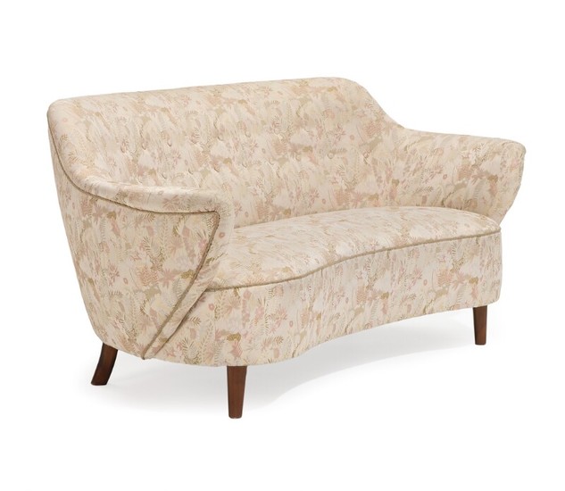 Danish furniture design: A two-seater sofa with stained beech legs, upholstered with light coloured floral brocade fabric. L. 160 cm.