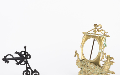 Decorative brass photo frame and iron hanger with anchors.