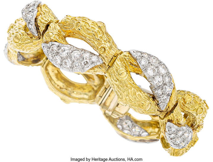 Diamond, Platinum, Gold Bracelet The bracelet features circular brilliant-cut...