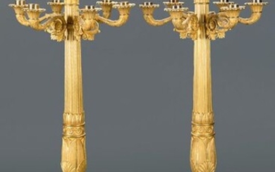 Exceptional pair of Empire candlesticks. France, 1810-15. In golden brocade, with five arms and six lights. Plinths with lyres and laurels and shafts with papyriform shapes. Height: 80 cm. Exit: 15000uros. (2.495.790 Ptas.)
