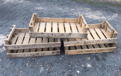 Five rectangular garden produce trays with slatted bases, stencilled with...