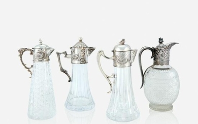 Four silver-mounted cut-glass claret jugs, 19th century