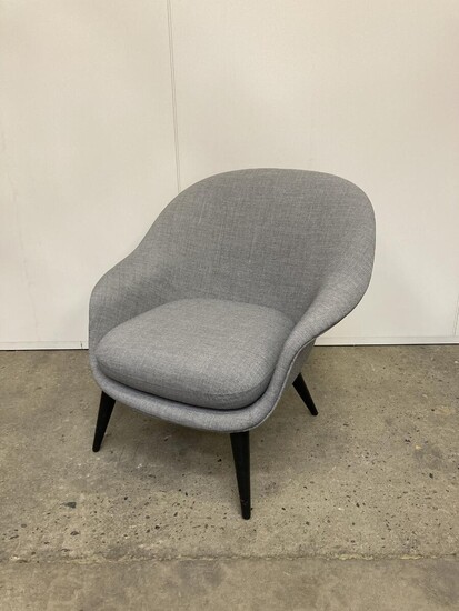 NOT SOLD. GamFratesi: "Bat" lounge chair upholstered with grey fabric, legs off black lacquered wood. Manufactured by Gubi. H. 82. W. 85 cm. – Bruun Rasmussen Auctioneers of Fine Art