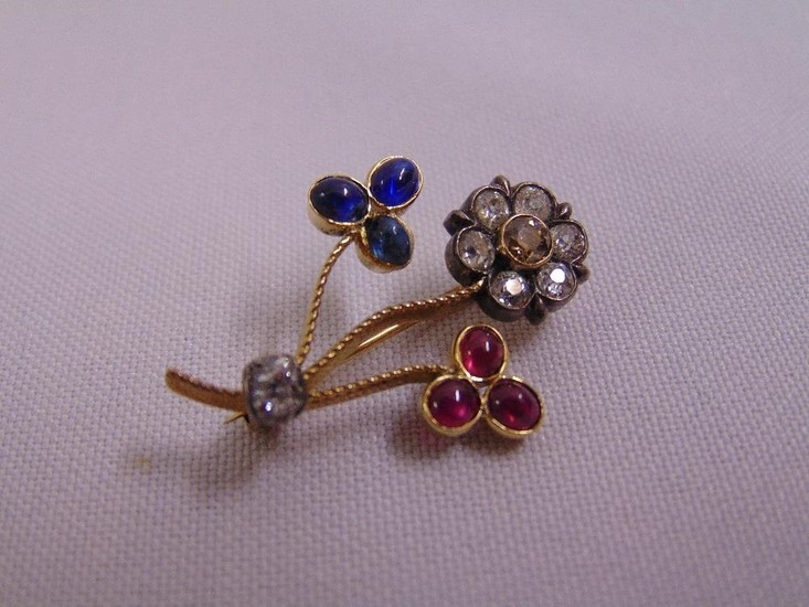 Gold, diamond, ruby and sapphire flower brooch, tested 15ct,...