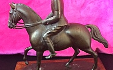 Johan G. C. Galster: An equestrian patinated metal statue of King Chr. X, wooden base. Marked Galster 41. H. incl. base 17,5. L. 15 cm.