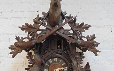 Large black Forest cuckoo clock with hunt themed
