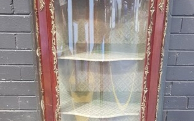 Louis XV Style Vitrine, with brass gallery top & extensive mounts, serpentine fronted glass panel door, raise don cabriole legs (H:1...