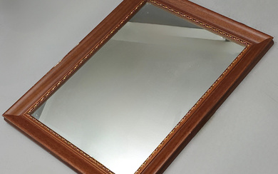 MIRROR WITH WOODEN FRAME AND GOLDEN EDGE DETAIL FORMING A BORDER.