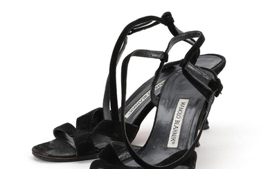 Manolo Blahnik A pair of stilettos of black suede with adjustable ancle...