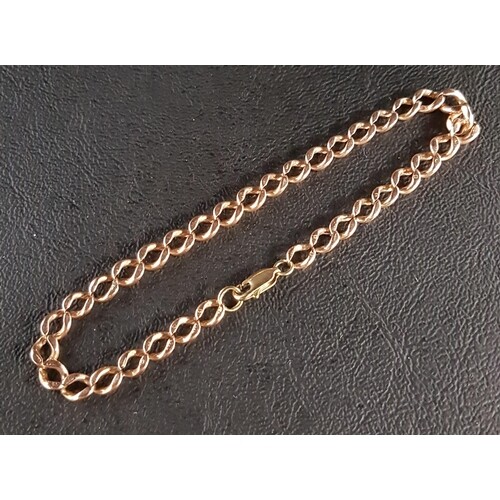 NINE CARAT ROSE GOLD CURB LINK BRACELET with yellow gold cla...