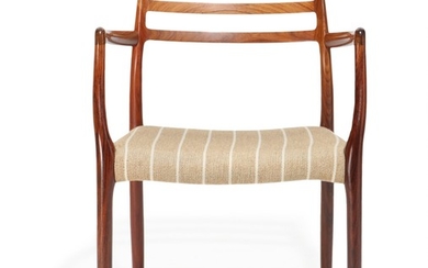 Niels O. Møller: A Brazilian rosewood armchair, seat with light striped wool. Model 62. Designed 1962. Manufactured by J. L. Møller.