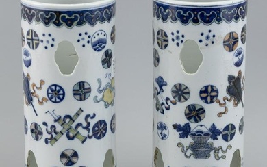 PAIR OF CHINESE POLYCHROME PORCELAIN HAT STANDS Late 19th/Early 20th Century Heights 11". Diameters