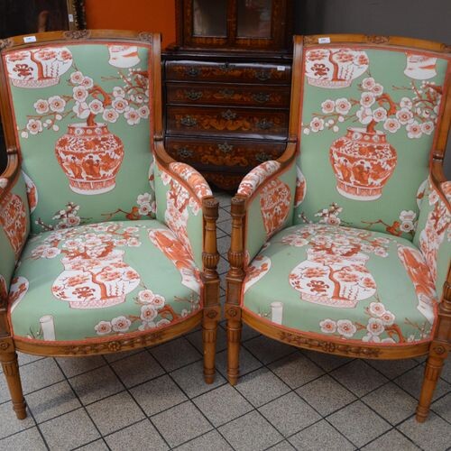 Pair of Directoire style armchairs in carved cherry wood, upholstered...