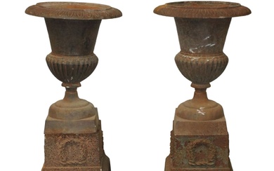 Pair of French classical cast iron urn planters on bases