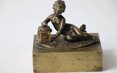 Paperweight in patinated bronze depicting a child leaning...