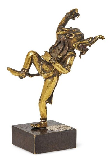 Property of a Gentleman (lots 36-85) A Tibetan gilt-bronze bardo Makara-headed dancing deity, 17th century, richly gilded and cast in energetic posture, 9cm high, on metal stand Provenance: Ex Seward Kennedy Collection Note: In Buddhist scripture...