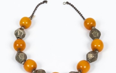 Silver necklace with Yemeni yellow gum-resin beads. The...