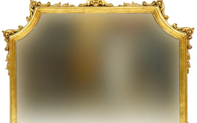 Specchiera di linea sagomata in legno intagliato e dorato, prima metà XX secolo, ingombro cm 81x101, (difetti)