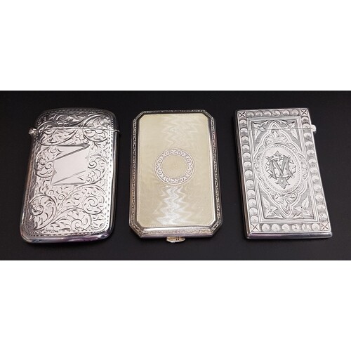 TWO SILVER CARD CASES AND AN ENAMEL DECORATED SILVER CIGARET...