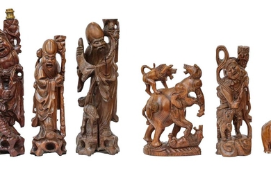 Four various 20th century Oriental carved rootwood table lamps,...