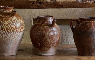 Three red earthenware potteries with white engobe decoration...