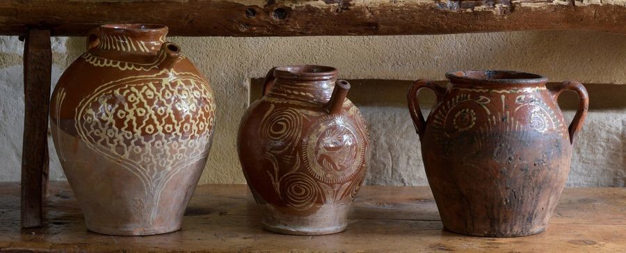Three red earthenware potteries with white engobe decoration...