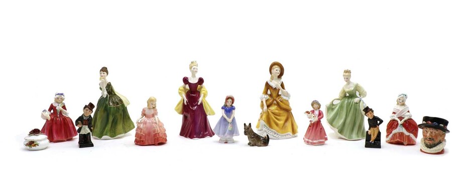 Twelve Royal Doulton figures and a character jug