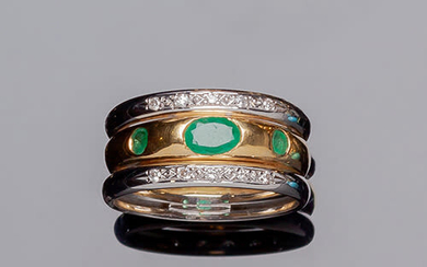 Two-tone gold ring, with a central fine emerald, flanked...