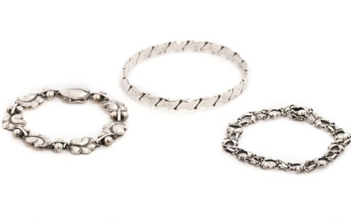 Harald Nielsen a.o.: A silver bracelet and a sterling silver bracelet and bangle. Georg Jensen and Hans Hansen. (3)