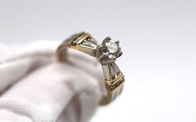 14K White and Yellow Gold Ring with 6 diamonds on sides and 1 round diamond as center stone. Size 6