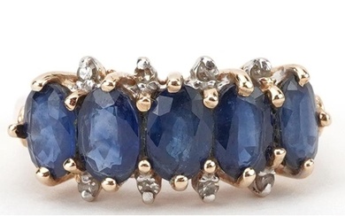 14K gold sapphire and diamond ring set with five sapphires a...