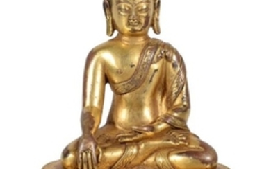 A gilt-bronze figure of Buddha, Tibet, circa 16th