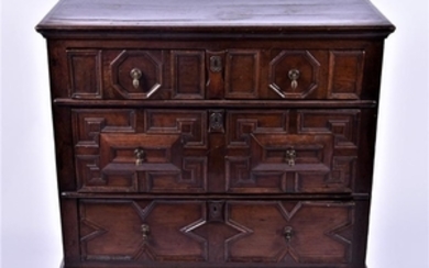 An 18th century oak chest with two short over two long drawers, moulded and fielded panelled drawer fronts with drop handles,...