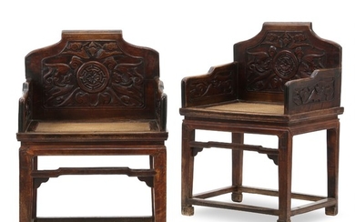 A pair of Chinese hardwood chairs with weaved seats and carved backs and sides. Qing Dynasty, 19th century. (2).