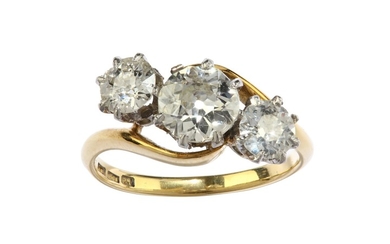 A diamond three-stone ring Set with graduated old...