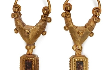 A pair of garnet-set gold earrings with...