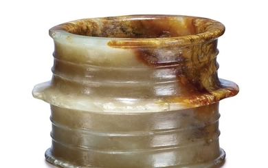 A YELLOW AND RUSSET JADE CYLINDER SHANG DYNASTY OR LATER