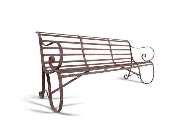 A WROUGHT IRON GAREN BENCH, with scroll side...