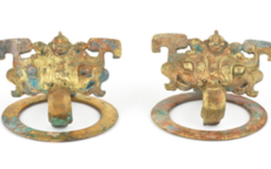 A rare pair of gilt-bronze 'taotie and figure' door handles, pushou