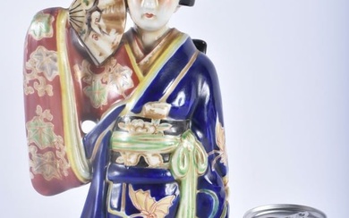 A 19TH CENTURY JAPANESE MEIJI PERIOD AO KUTANI PORCELAIN GEISHA modelled holding a fan. 30cm x 12 cm
