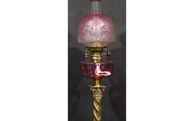 A 19th century brass oil lamp, Maple London, cranberry glass...