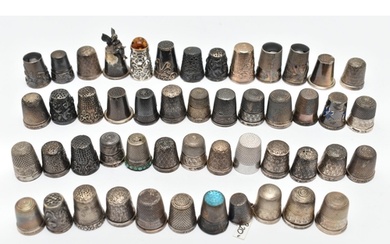 A BAG OF WHITE METAL THIMBLES, various designs and patterns,...