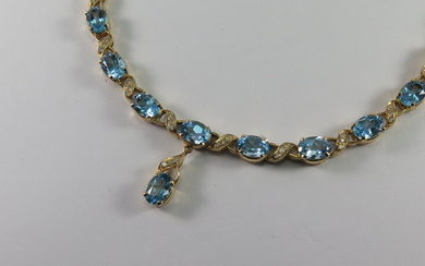 A BLUE TOPAZ, DIAMOND AND GOLD NECKLACE