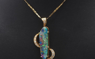 A BOULDER OPAL AND DIAMOND PENDANT WITH CHAIN IN 18CT GOLD, FEATURING A FREE FORM OPAL MEASURING 31x8.60x6.7MM, WITHIN A DECORATIVE...