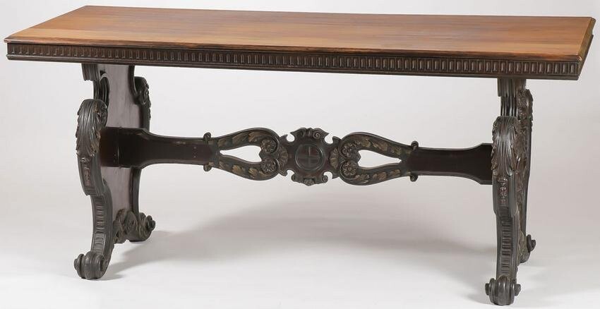 A CARVED DINING TABLE