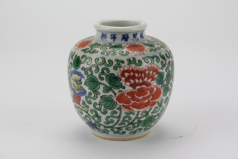 A Chinese Red ground and Green decorated Tibetan market vase...