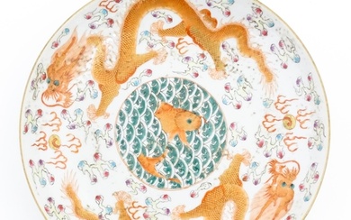 A Chinese dish decorated with central koi carp fish bordered...