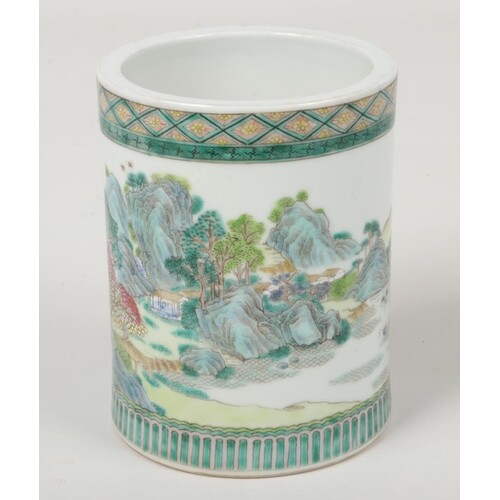 A Chinese famille verte brush pot. Decorated with a continui...